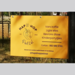 Yellow Signage with Hap & Hop Padstal information and contact details